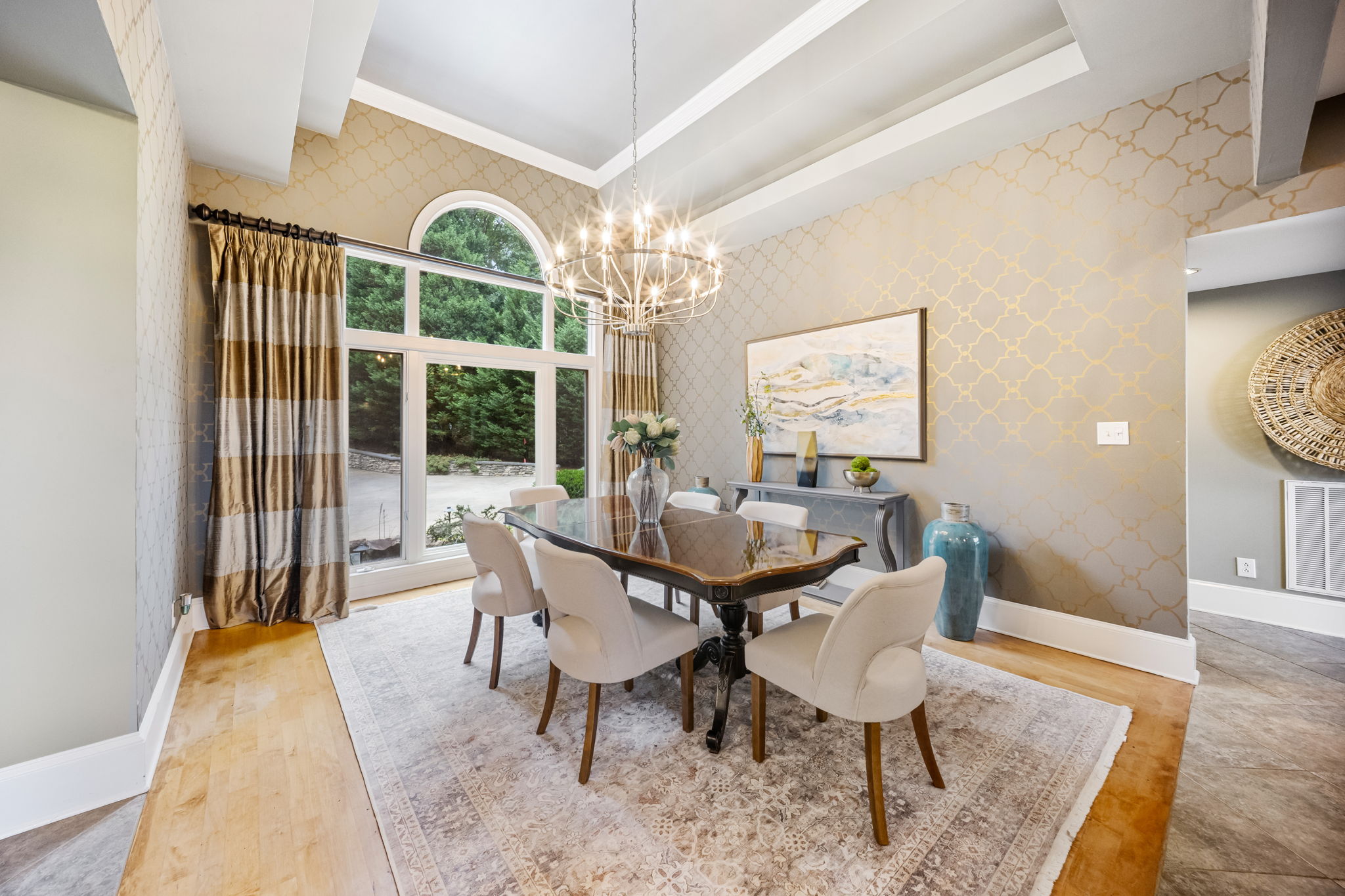Formal dining room with double tray ceiling and chandelier